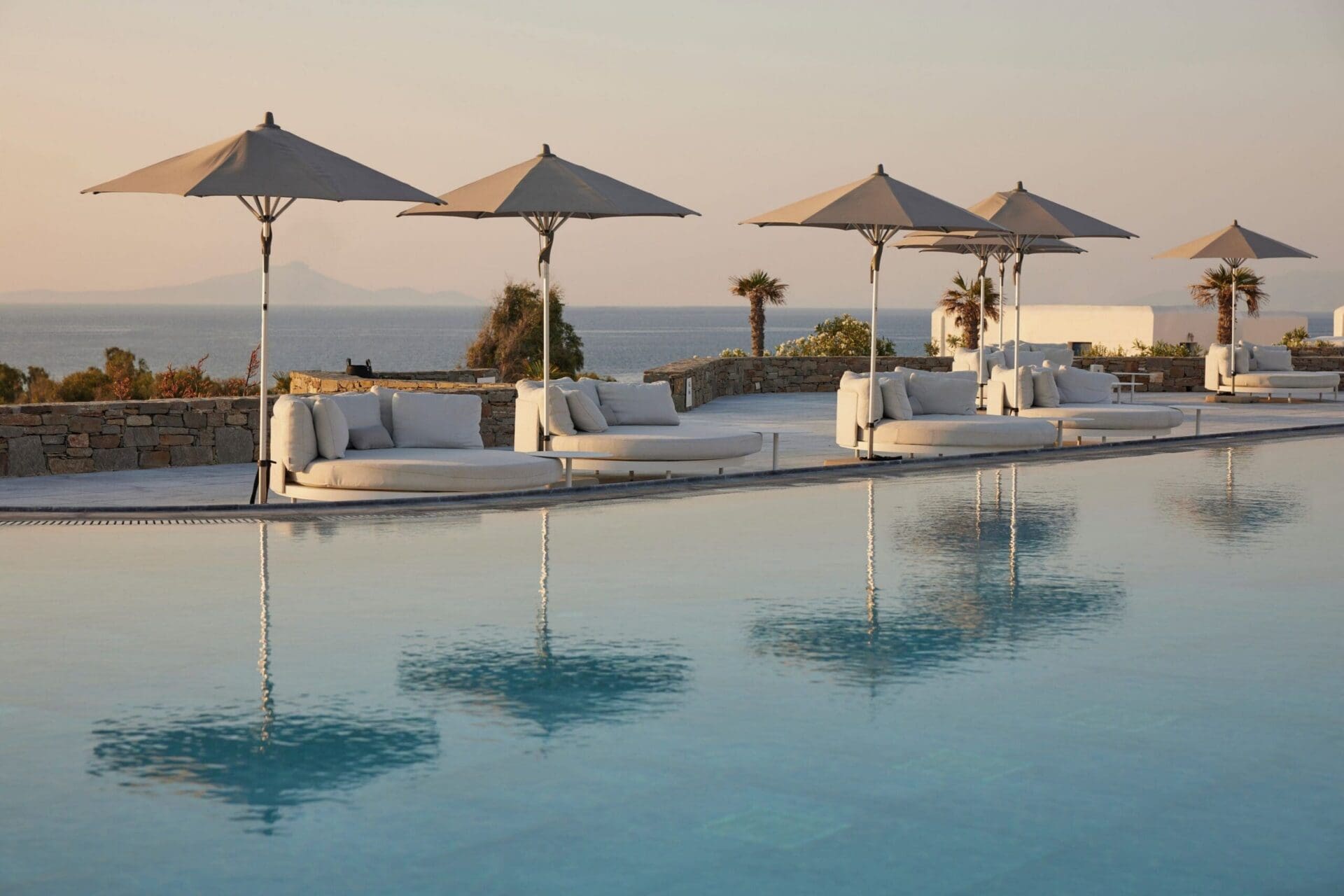 Summer Senses Luxury Resort Paros — whitewashed hillside resort with pool and Aegean views