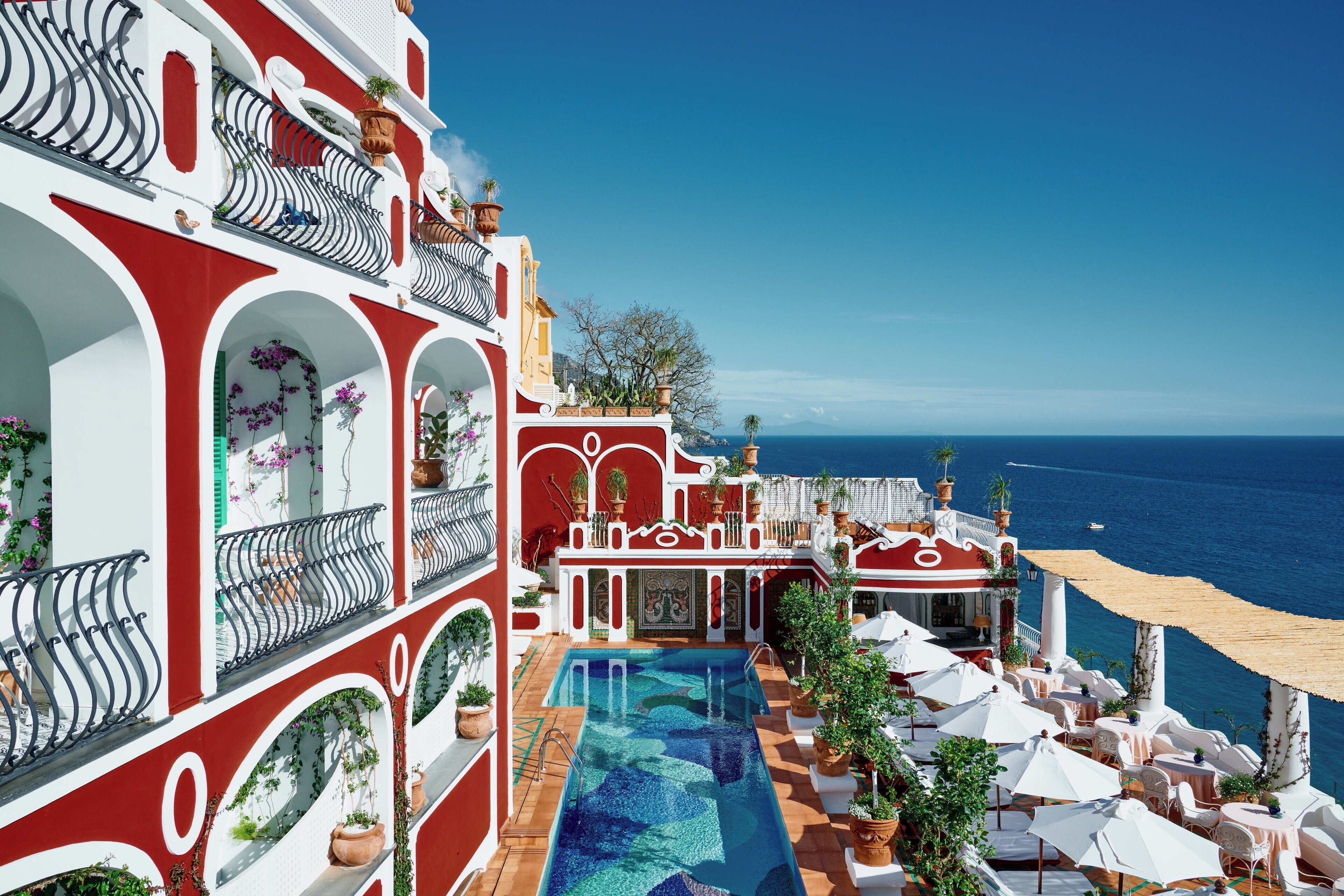 Le Sirenuse — cliffside hotel terrace overlooking Positano and the Amalfi Coast